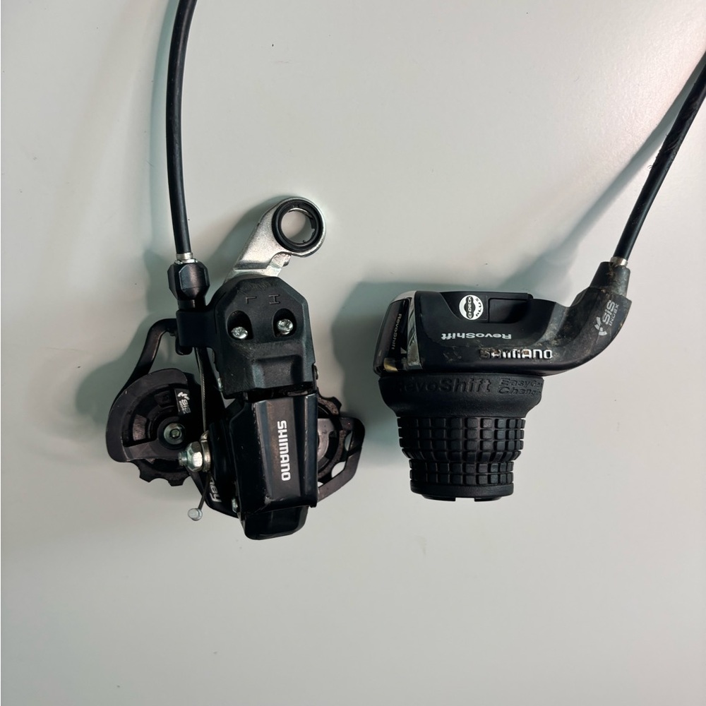 RevoShift Twist Shifter and a Shimano Tourney Rear Derailleur.